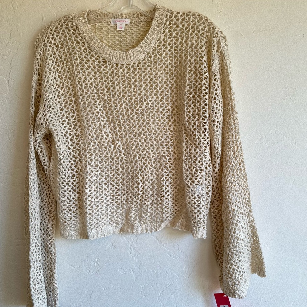 Open knit crew neck and bell sleeve crop sweater in cream. Size small
